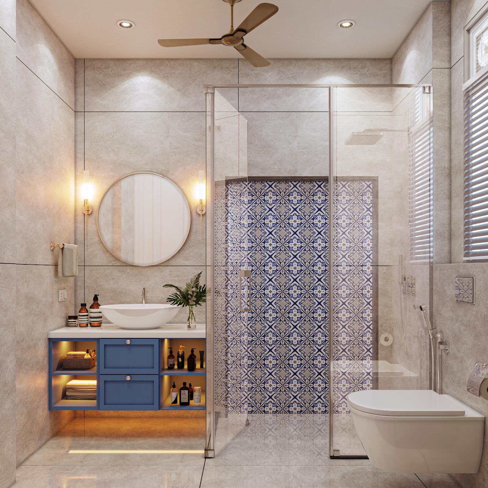 Bathroom with brass-framed round mirrors and patterned tiles
